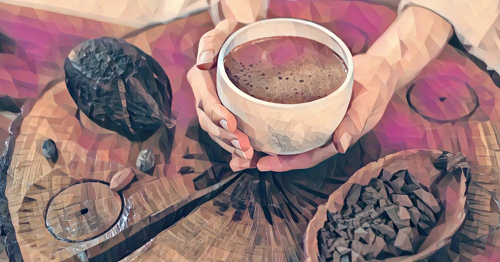 Two hands holding a ceremonial cacao cup, warm rose and amber tones, poly-art texture